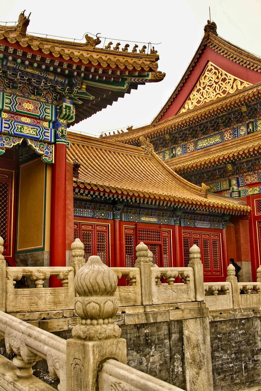 red building with gold roof and details in the forbidden city beijing china